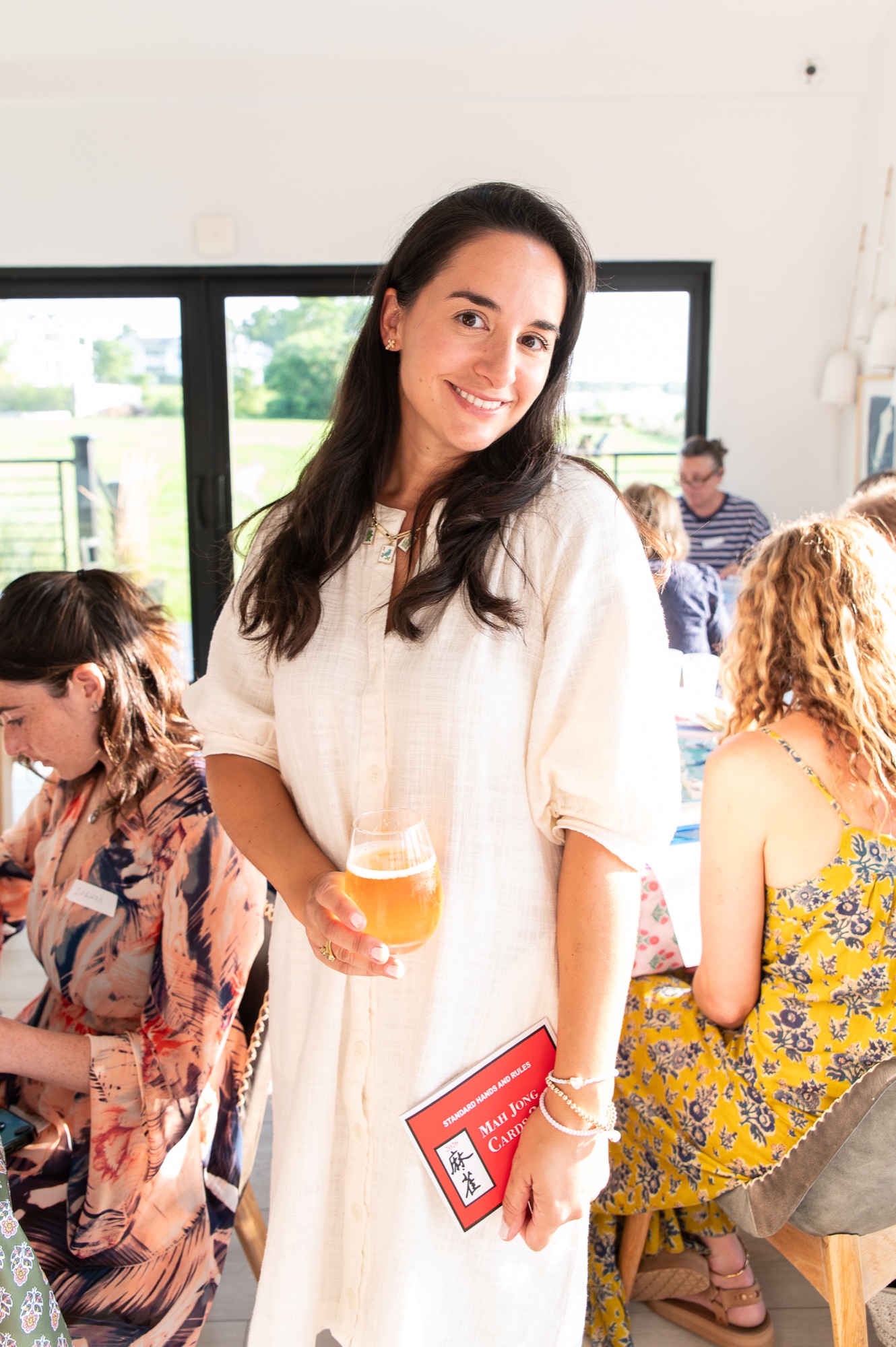 Stacy smiling at a NoFo Mahj gathering.